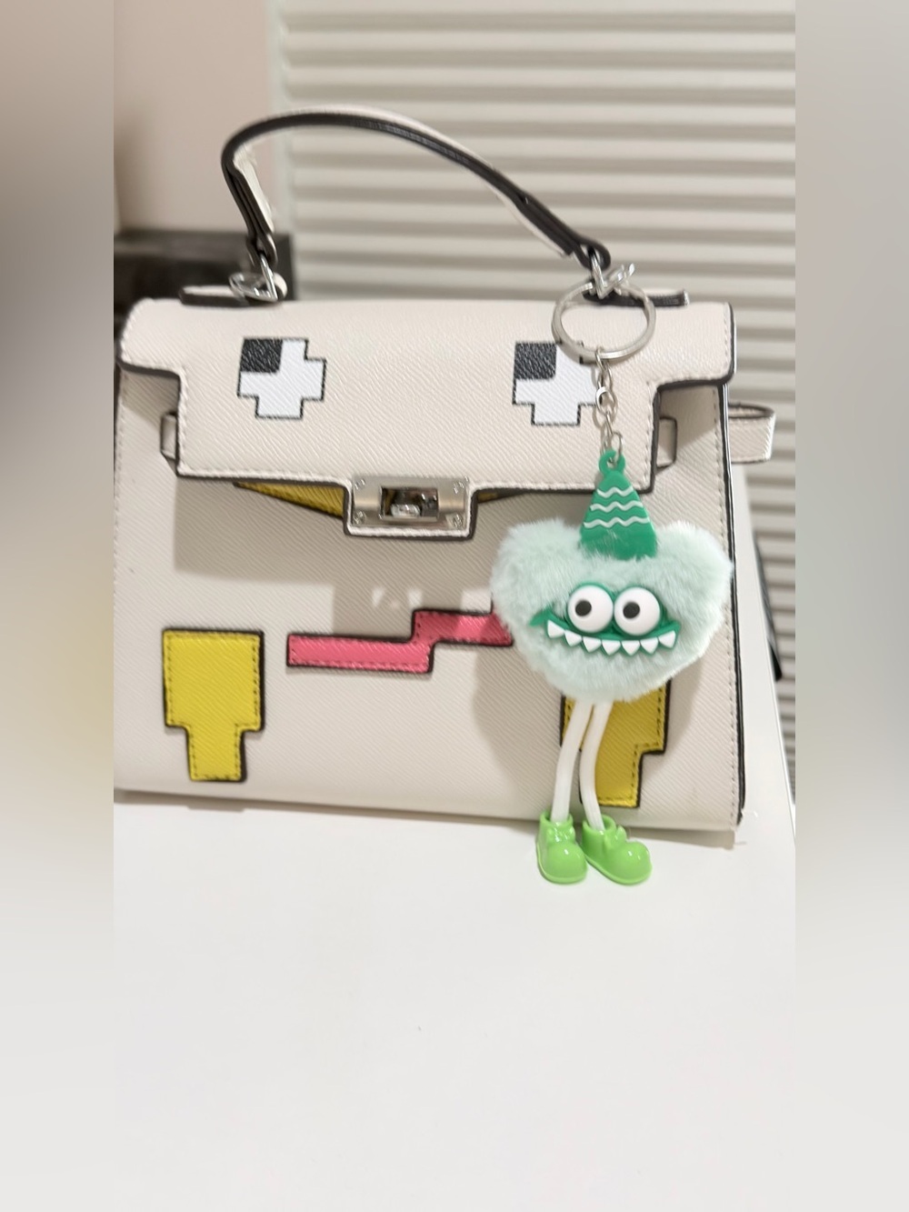 Structured White Top-Handle Bag with Yellow Accent